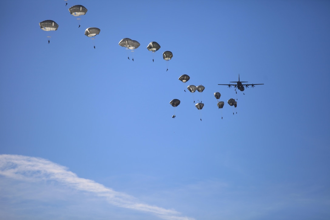 Paratroopers exit a C-130 Hercules aircraft during training over the Sicily Drop Zone on Fort Bragg, N.C., Nov. 21, 2015. U.S. Army photo by Spc. Darius D. Davis