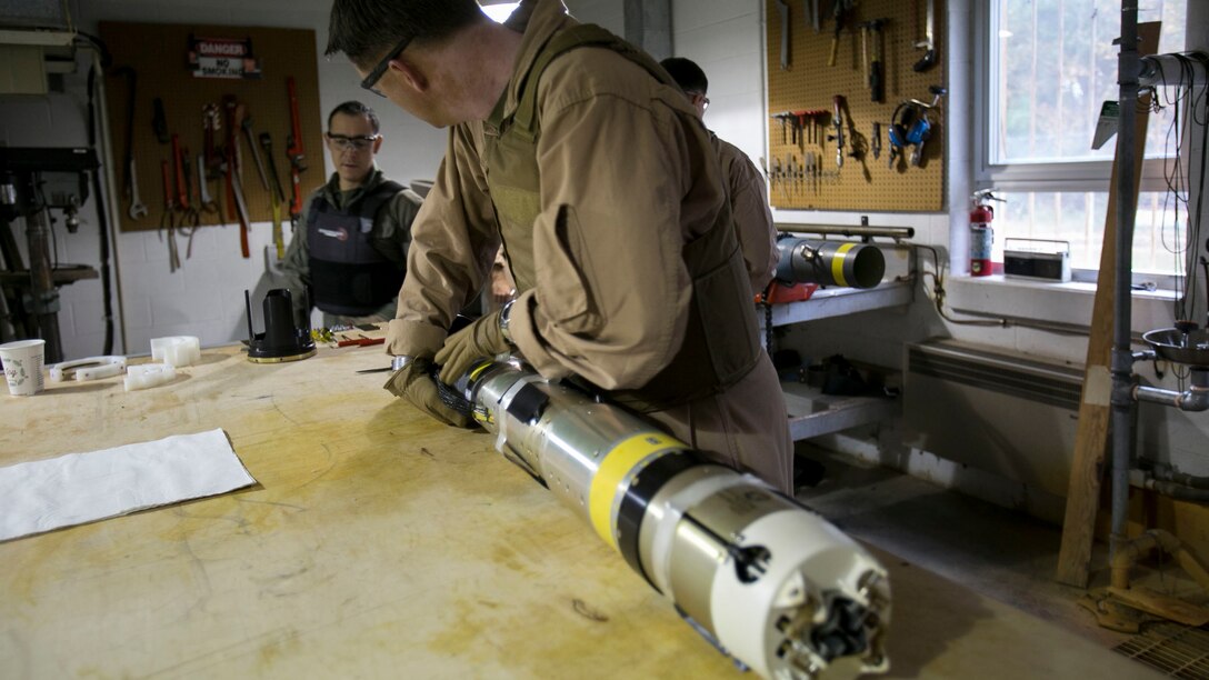 Chief Warrant Officer 2 Jason Scarborough, an Explosive Ordnance Disposal technician with EOD Company, begins to remove the explosive ordnance from the Griffin missile at Marine Corps Base Camp Lejeune, N.C., Dec. 1, 2015. A Griffin missile is an air and ground-launched, precise, low collateral-damage missile used for irregular warfare operations. 