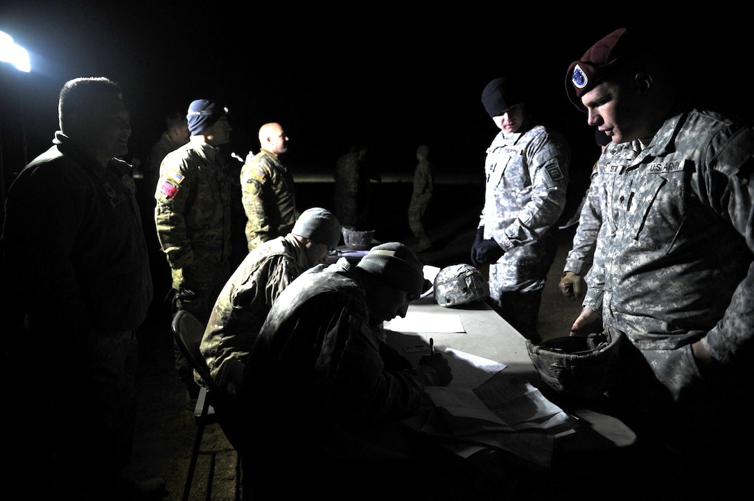 Paratroopers conduct initial manifest as part a proficiency jump program over the Sicily Drop Zone on Fort Bragg, N.C., Nov. 21, 2015. U.S. Army photo by Staff Sgt. Edward Reagan