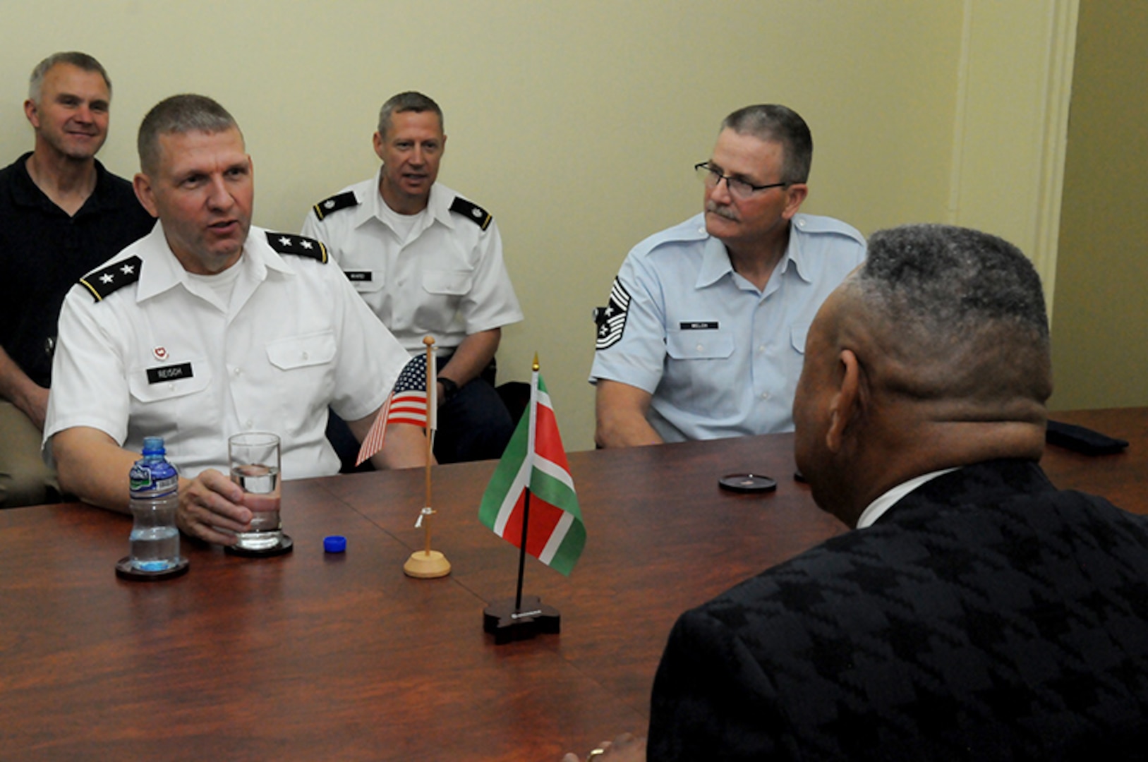 U.S. Army Maj. Gen. Tim Reisch, adjutant general for
the South Dakota National Guard and State Command Chief Master Sgt. James Welch, SDNG senior enlisted leader, meet with Suriname’s Minister of Defense Ronni Benschop, during a distinguished leaders visit to Paramaribo, Suriname, Nov. 25, 2015. 

