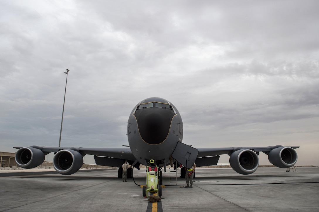 U.S. airmen perform pre-flight checks on a U.S. Air Force KC-135T Stratotanker on the flightline before a refueling mission at Southwest Asia, Nov. 24, 2015. The airmen are assigned to the 340th Expeditionary Air Refueling Squadron. U.S. Air Force photo by Staff Sgt. Corey Hook