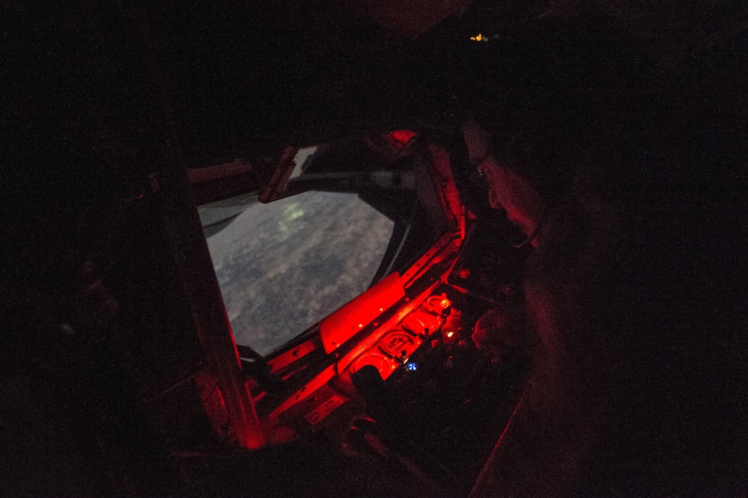 U.S. Air Force Tech. Sgt. James Marier uses the boom of a KC-135T Stratotanker to refuel a F-16 Fighter Falcon in support of Operation Inherent Resolve over Southwest Asia, Nov. 24, 2015. Marier is a boom operator assigned to the 340th Expeditionary Air Refueling Squadron, and deployed out of the 157th Air Refueling Wing in New Hampshire Air National Guard. U.S. Air Force photo by Staff Sgt. Corey Hook