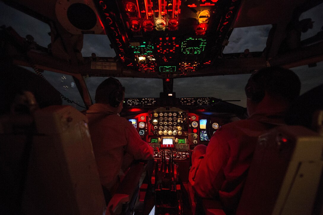 U.S. Air Force Capt. Mark Costa, left, and U.S. Air Force Maj. Joseph Corpening fly a KC-135T Stratotanker in support of Operation Inherent Resolve over Southwest Asia, Nov. 24, 2015. Costa and Corpening are pilots assigned to the 340th Expeditionary Air Refueling Squadron. U.S. Air Force photo by Staff Sgt. Corey Hook