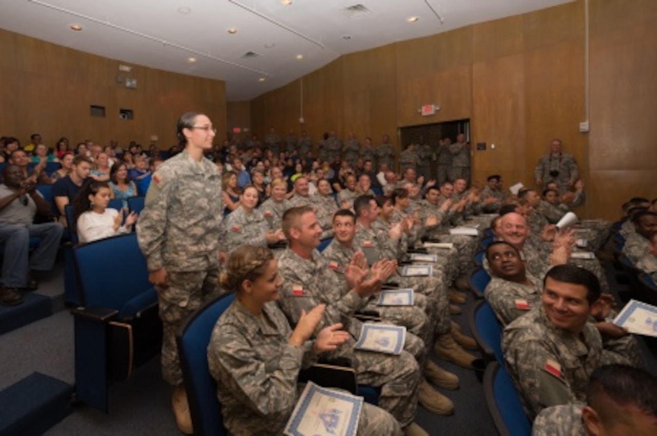 Regional Basic Orientation Training Class 010 recognizes Pvt. Angeline Sanchez, 2nd Battalion, 2nd Regiment, Texas State Guard, as the honor graduate at a ceremony held in Austin, Texas, Sept. 20, 2015. RBOT is held twice a year in different areas across the state to teach new State Guardsmen military customs, basic first aid and CPR, drill and ceremony, land navigation and radio communication skills. The training is broken up into two phases, which take place during monthly drill. U.S. Army National Guard photo by Sgt. 1st Class Malcolm McClendon