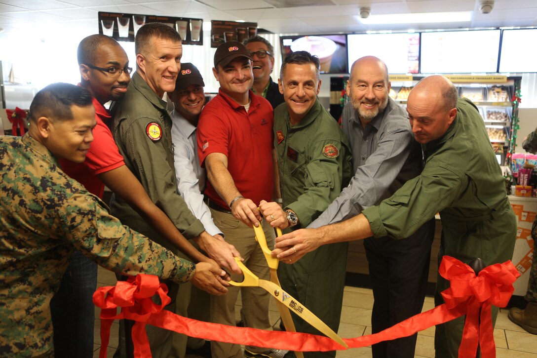 Maj. Gen. Michael Rocco, commanding general of the 3rd Marine Aircraft Wing, and Col. Jason Woodworth, commanding officer of Marine Corps Air Station Miramar, cut the ribbon at the grand opening of Dunkin’ Donuts aboard MCAS Miramar, Calif., Dec. 2. Col. Adam Holmes, 3rd MAW Chief of Staff and Lt. Col. Donald Presto, executive officer of MCAS Miramar, also attended the ceremony.