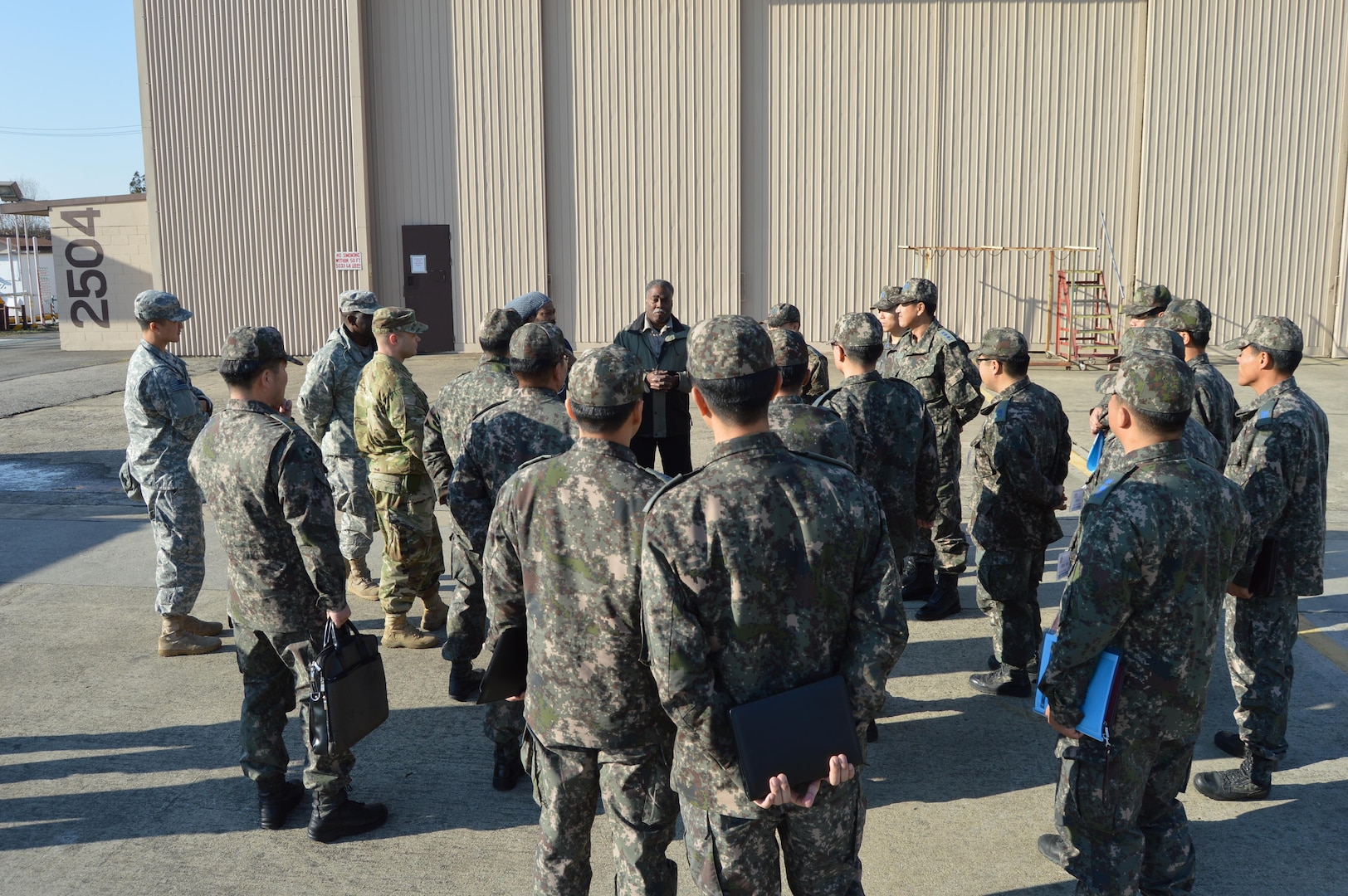 Senior Raytheon Supervisor, Ronald Greene briefs a contingent of US/ROK air defenders at Suwon Air Base, Nov. 30. The briefing was part of 35th Air Defense Artillery’s annual Patriot Technology Exchange with the ROK Air Force’s Air and Missile Defense Command.
