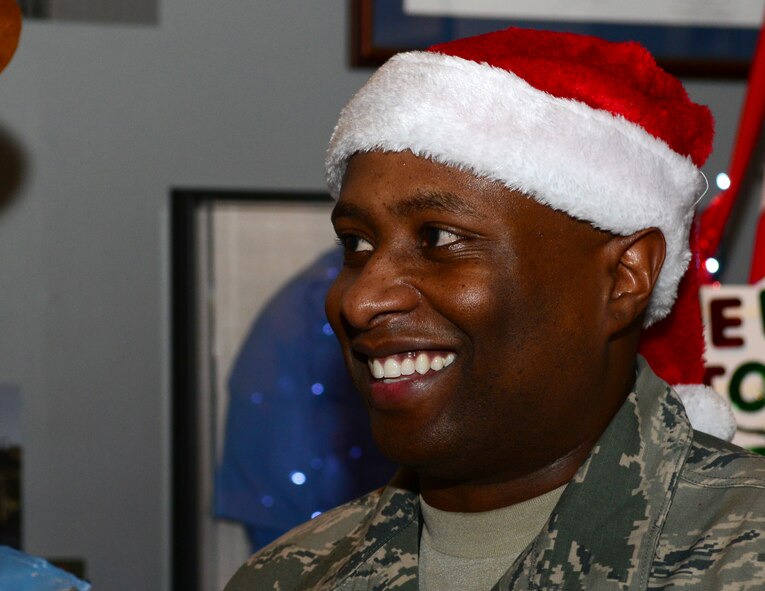 Master Sgt. Tyryne Livone, 608th Air Operations Center combat plans division superintendent, talks with Festivus visitors during the Mighty Eighth Festivus celebration at Barksdale Air Force Base, La., Dec. 2, 2015. The Festivus celebration brought Airmen and families together for a multicultural celebration. (U.S. Air Force photo/Senior Airman Benjamin Raughton)