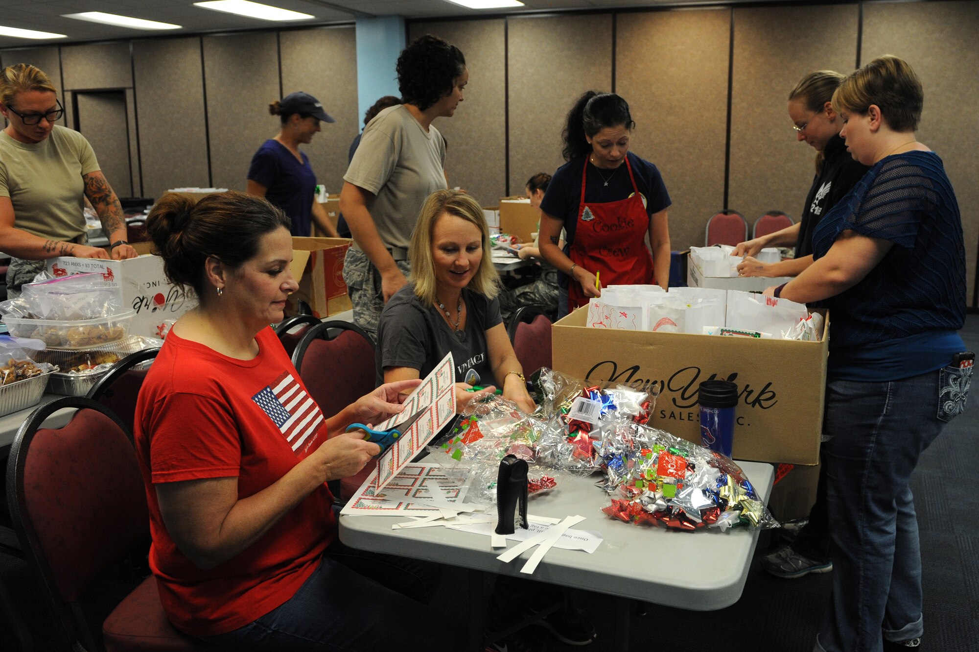 Volunteers finish decorating bags for the Annual Airmen’s Cookie Drive, Dec. 2, 2015, at Moody Air Force Base, Ga. The volunteers packed more than 600 bags of cookies for Airmen living in the dorms on base. (U.S. Air Force photo by Airman 1st Class Kathleen D. Bryant/Released)
