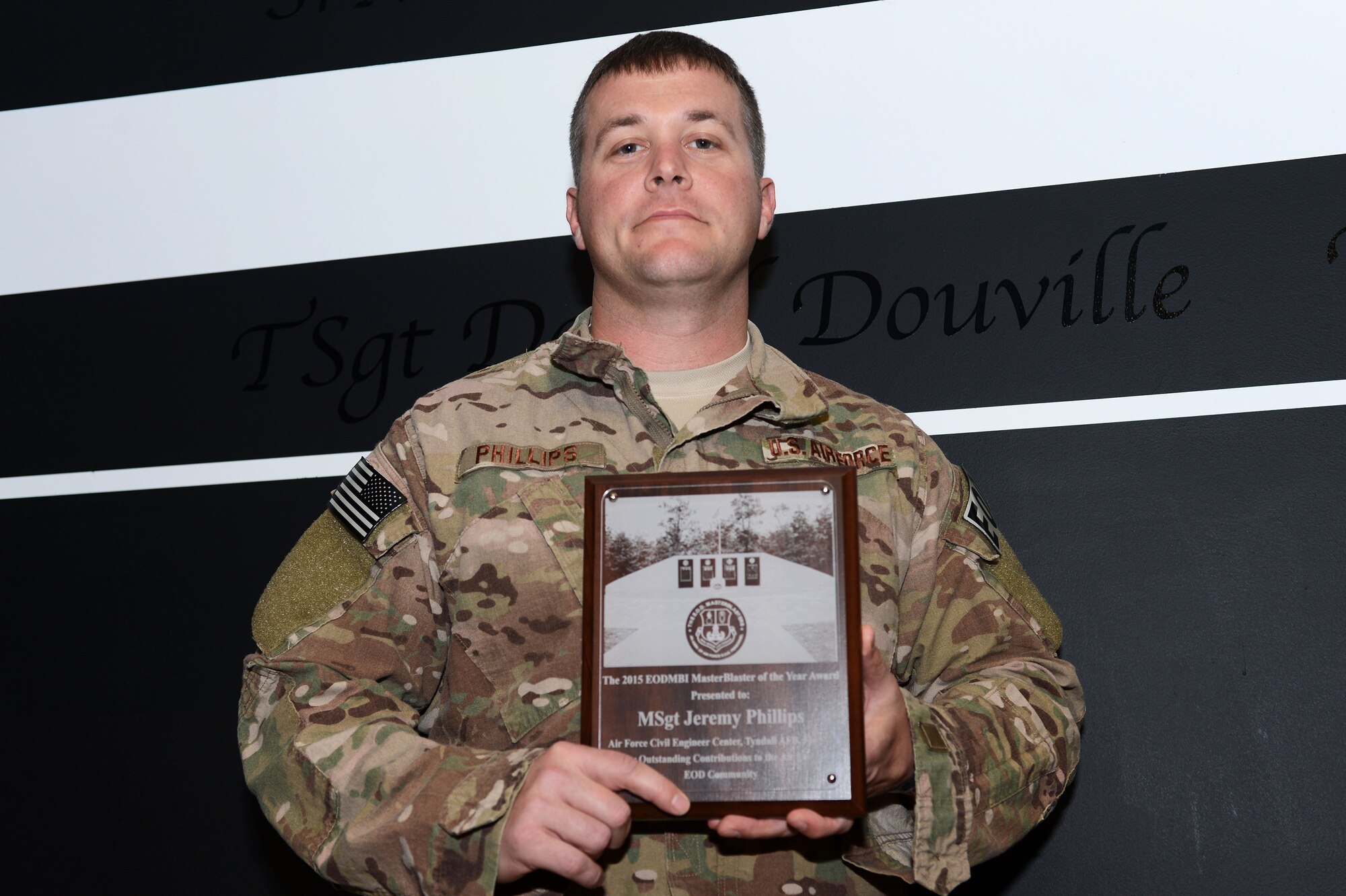 U.S. Air Force Master Sgt. Jeremy Phillips, 20th Civil Engineer Squadron explosive ordnance disposal flight superintendent, holds the 2015 Air Force EOD Master Blaster of the Year award at Shaw Air Force Base, S.C., Dec. 2, 2015. Phillips earned the award based on his significant accomplishments, mission impact, and quality of work. (U.S. Air Force photo by Senior Airman Zade Vadnais)