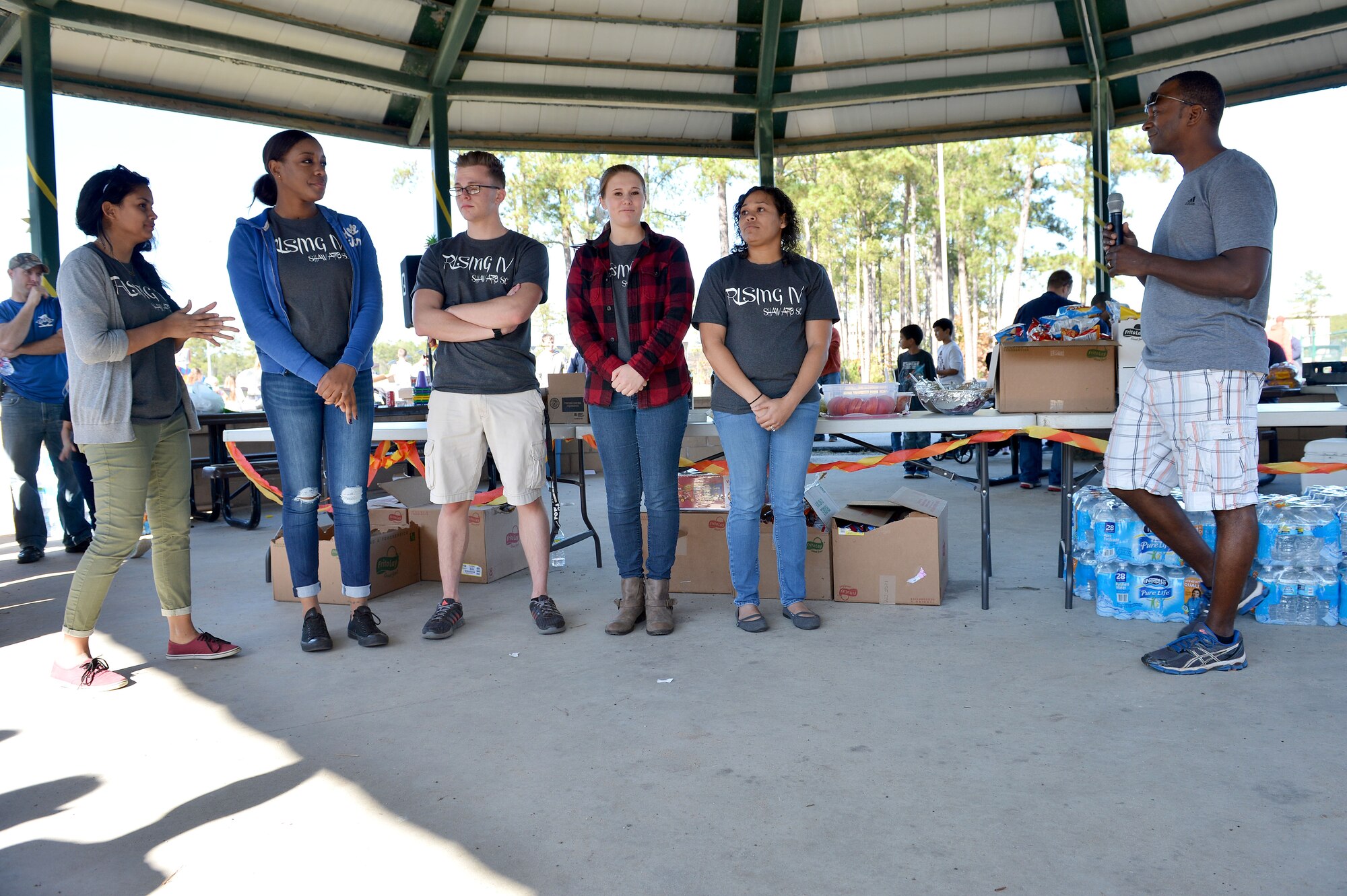 U.S. Air Force Chief Master Sgt. Christopher McKinney, 20th Fighter Wing command chief, speaks to Team Shaw and Rising IV members during a Fall Family Picnic event at Shaw Air Force Base, S.C., Nov. 21, 2015. To promote professional growth, 20th Fighter Wing leadership allowed Rising IV Airmen to organize the Team Shaw event. (U.S. Air Force photo by Senior Airman Diana M. Cossaboom)