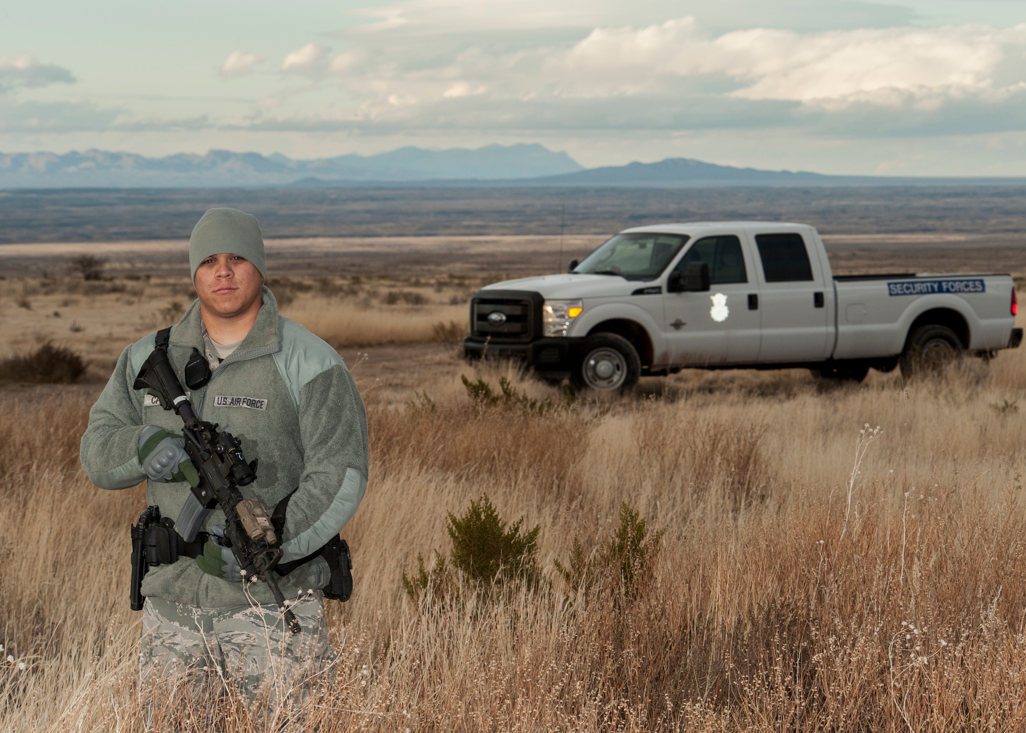 Staff Sgt. Aaron Calzada, a Security Forces team leader, stands guard at an F-16 crash scene Northwest of Salinas Peak, New Mexico, Nov. 26. Security Forces was one of several agencies to arrive in the first wave of responders following the F-16 crash. The crash site is currently under investigation. (U.S. Air Force photo by Airman 1st Class Randahl J. Jenson)