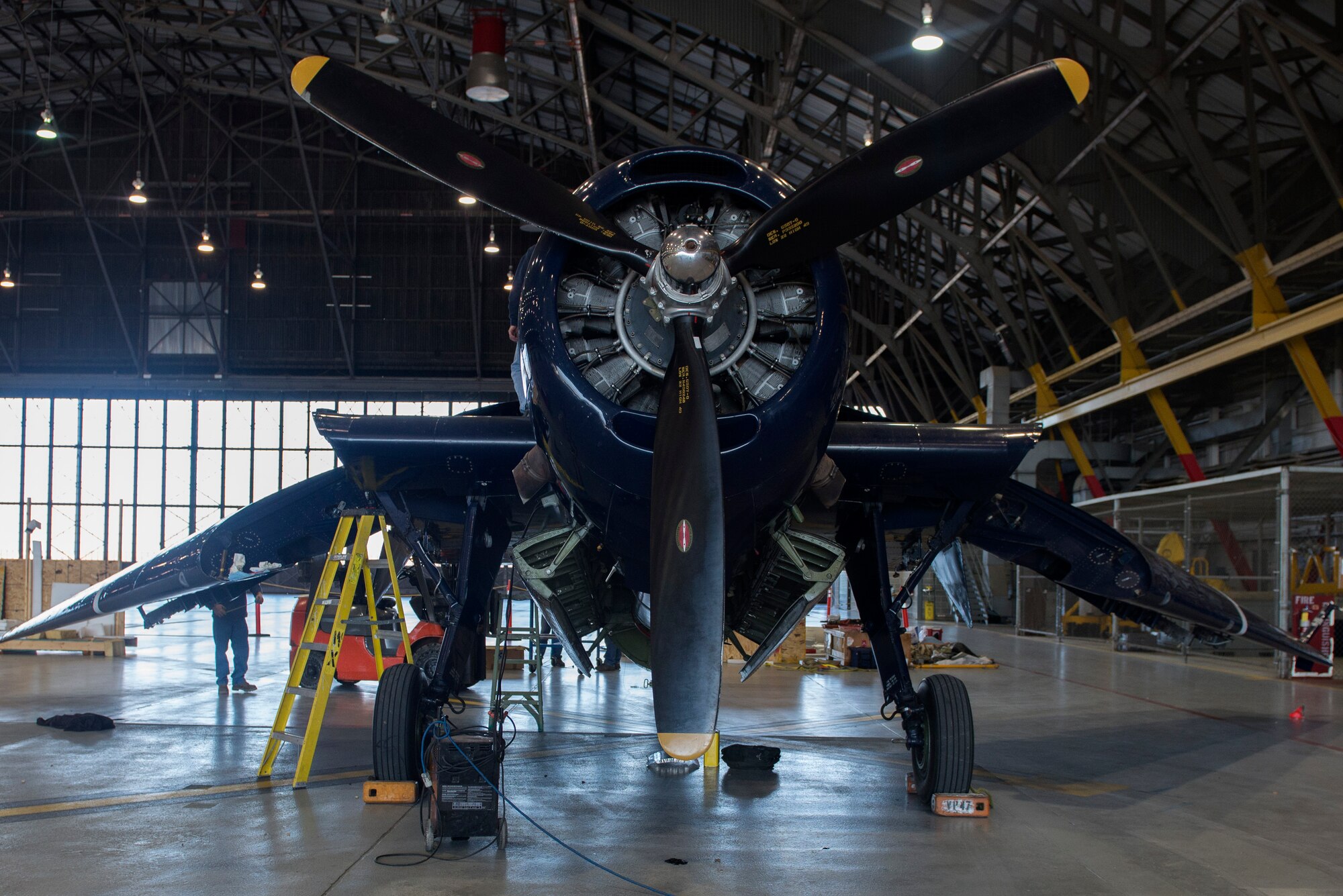 A 1945 TBM Avenger was brought to Scott Air Force Base, Ill. for maintenance repairs Nov. 22, 2015. This same aircraft was parked on the deck of an aircraft carrier in Tokyo Bay when the surrender was signed by the Japanese. Scott’s Operations Support Squadron provided Brad Deckert, owner of the aircraft, with the best accommodations and necessary supplies needed to complete the job.  (U.S. Air Force Photo/ Airman 1st Class Kiana Brothers) 