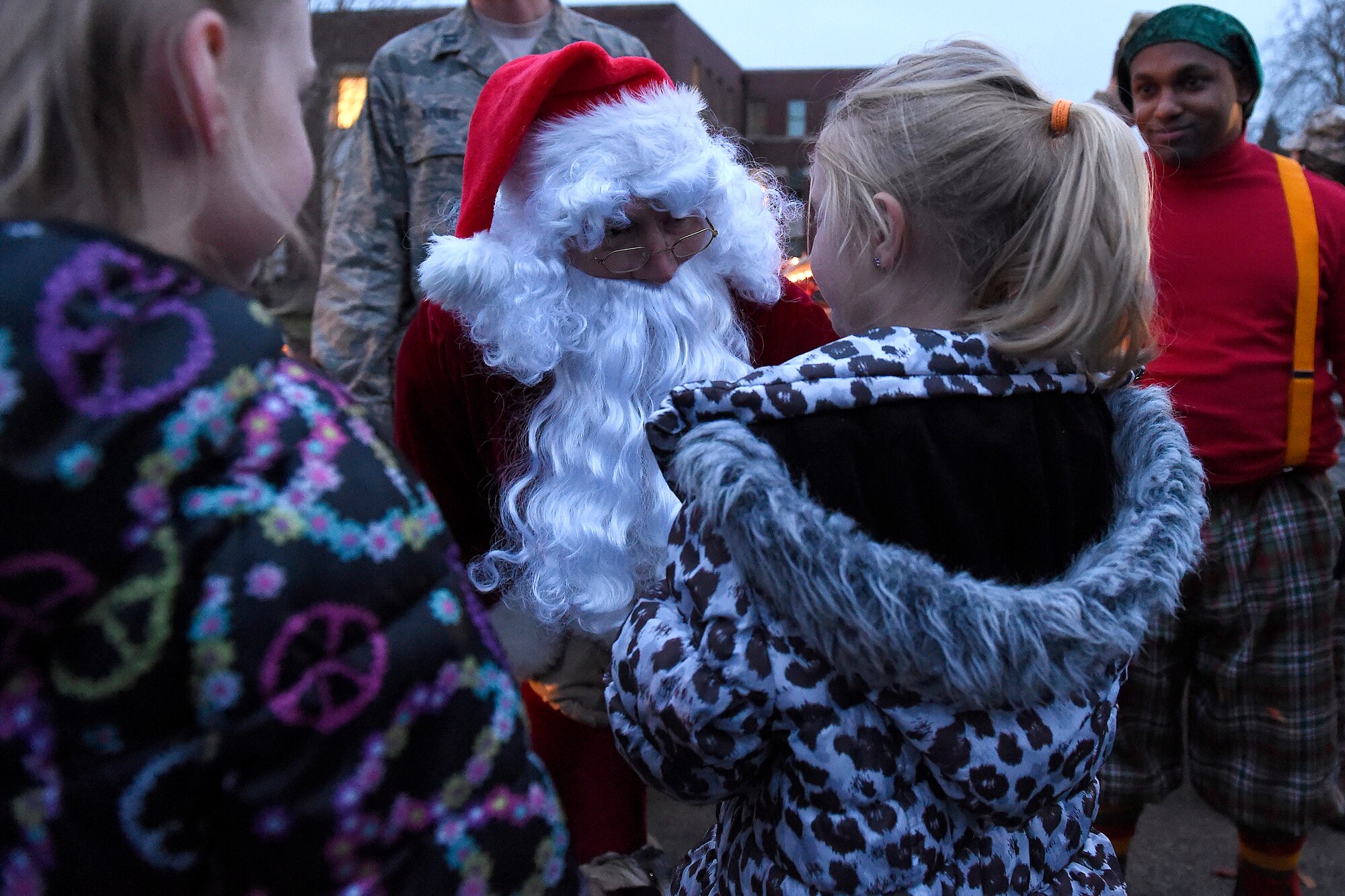 Santa greets children at the McChord Field Annual Holiday Lighting Ceremony Dec. 2, 2015 at Joint Base Lewis-McChord, Wash. Santa handed out candy and later took photos with the children while taking their request for their possible gifts. (U.S. Air Force photo by Tech. Sgt. Tim Chacon)  