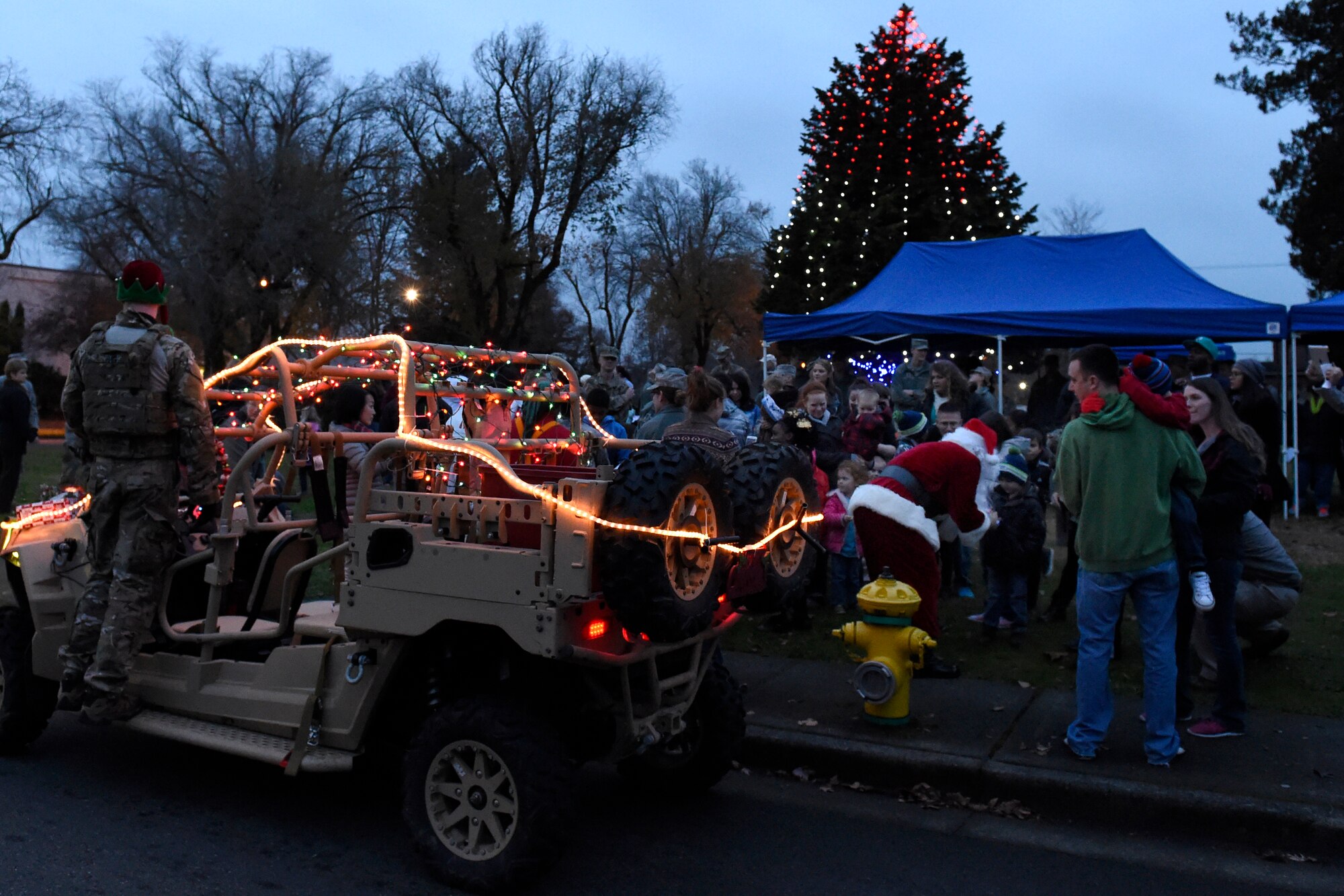 Santa arrives at the McChord Field Annual Holiday Lighting Ceremony Dec. 2, 2015 at Joint Base Lewis-McChord, Wash. Santa’s festive tactical arrival was made possible by the 22nd Special Tactics Squadron. (U.S. Air Force photo by Tech. Sgt. Tim Chacon) 