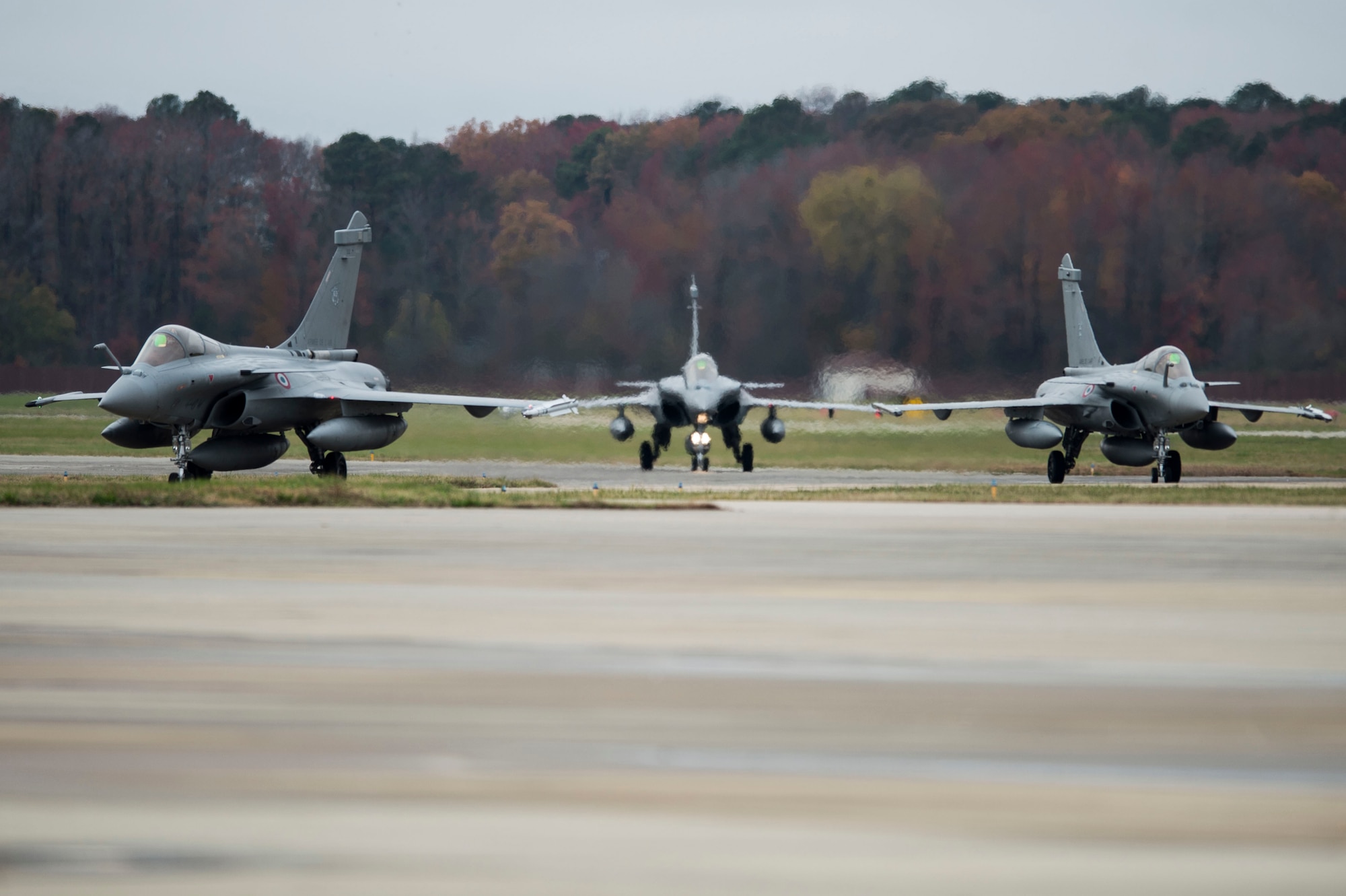 French Air Force (FrAF) Dassault Rafale’s, arriving for inaugural U.S. Air Force, British Air Force and FrAF Trilateral Exercise, taxi after landing at Langley Air Force Base, Va., Dec. 1, 2015. The intent of the exercise is to gain an understanding of the logistics, support requirements, capabilities, tactic, techniques and procedures associated with the integrated operation of coalition fighters.  (U.S. Air Force photo by Senior Airman Kayla Newman)
