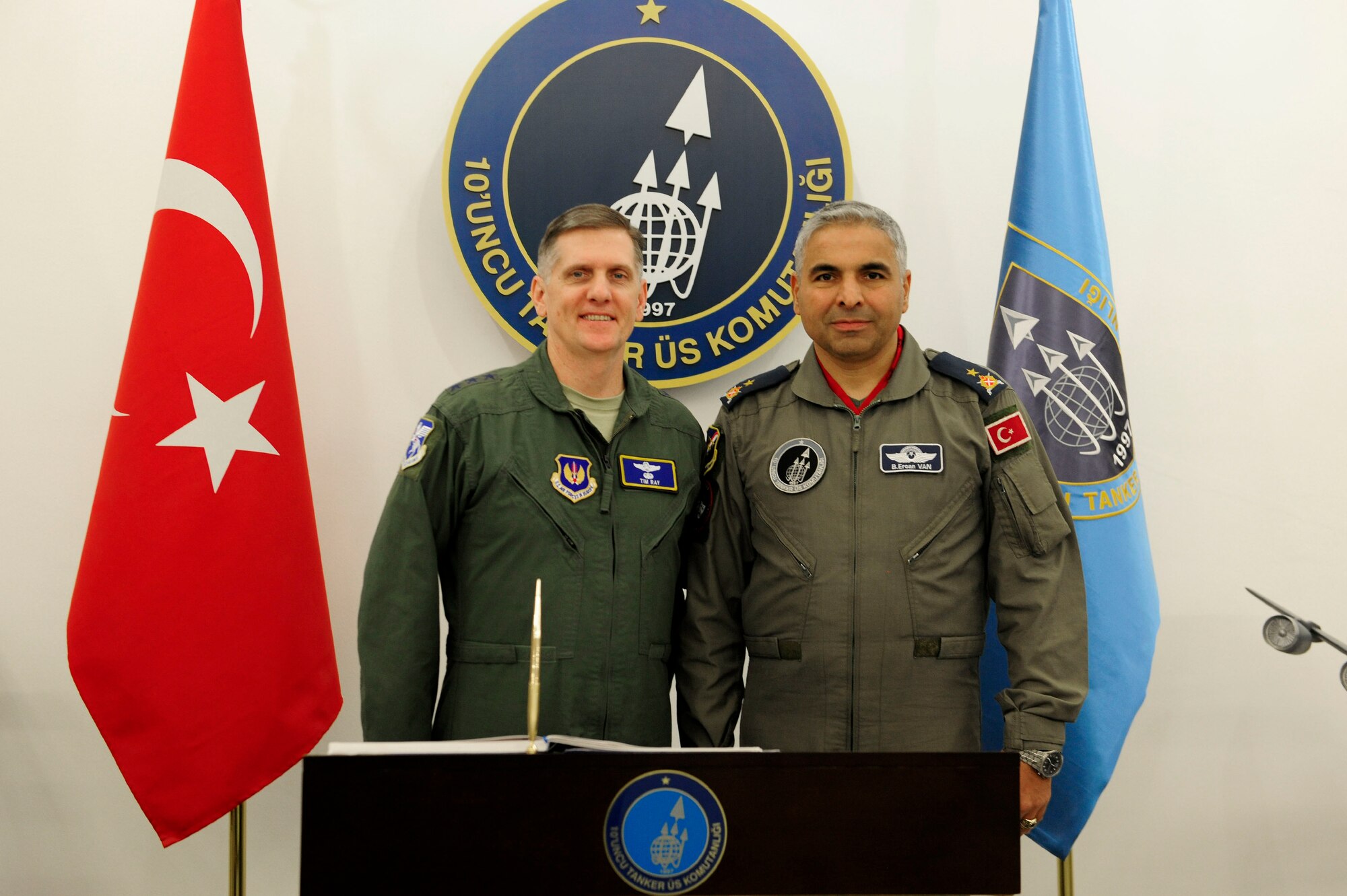 Lt. Gen. Timothy M. Ray, 3rd Air Force commander, and Brig. Gen. Bekir Ercan Van, 10th Tanker Base Command commander, stand together after Ray signed the 10th Tanker Command guest book during a base tour Dec. 1, 2015, at Incirlik Air Base, Turkey.  During his visit, Ray met with base leadership and Airmen while touring key facilities. (U.S. Air Force photo by Senior Airman Krystal Ardrey)