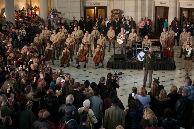 Members of the U.S. Air Force Band perform for an impromptu crowd at Union Station in Washington D.C., Dec. 3, 2015. The U.S. Air Force Band surprised commuters with a World War II Holiday Flashback.  The event was designed to be a special holiday musical presentation celebrating the service and sacrifices of our nation’s World War II veterans. (U.S. Air Force Photo/SrA Dylan Nuckolls)