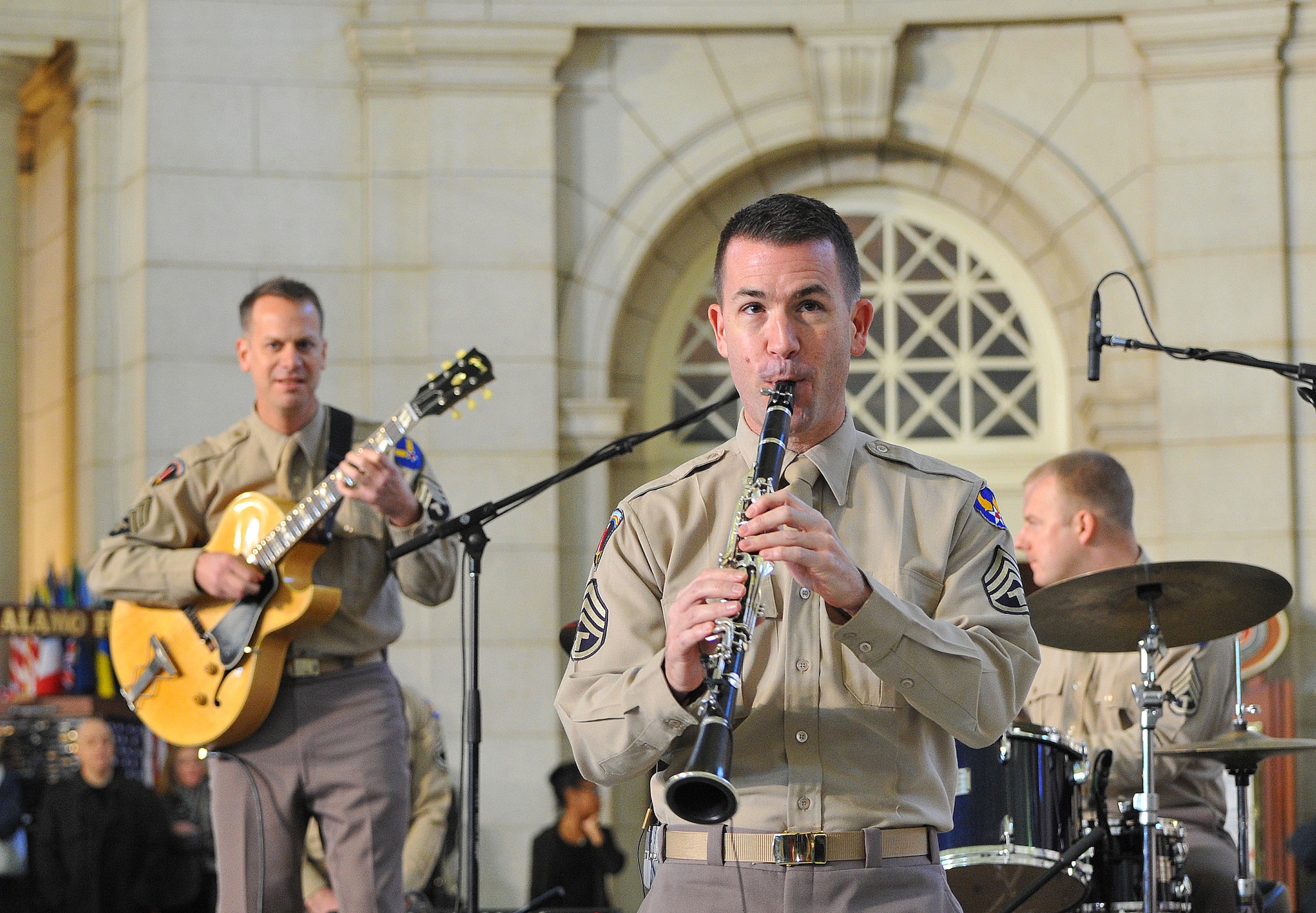 Master Sgt. Tyler Kuebler, a clarinetist with the Airmen of Note, performs for an impromptu crown at Union Station. The United States Air Force Band surprised commuters at Union Station with a World War II Holiday Flashback Dec. 3, 2015. The event was designed to be a special holiday musical presentation celebrating the service and sacrifices of our nation’s World War II veterans.