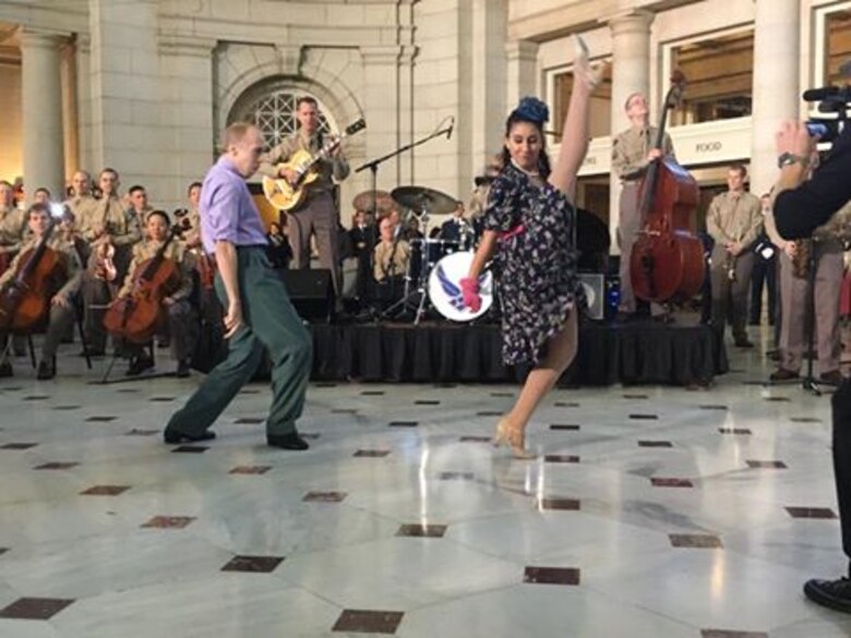 Swing dancers culminate the impromptu performance at Union Station. The United States Air Force Band surprised commuters at Union Station with a World War II Holiday Flashback Dec. 3, 2015. The event was designed to be a special holiday musical presentation celebrating the service and sacrifices of our nation’s World War II veterans.
