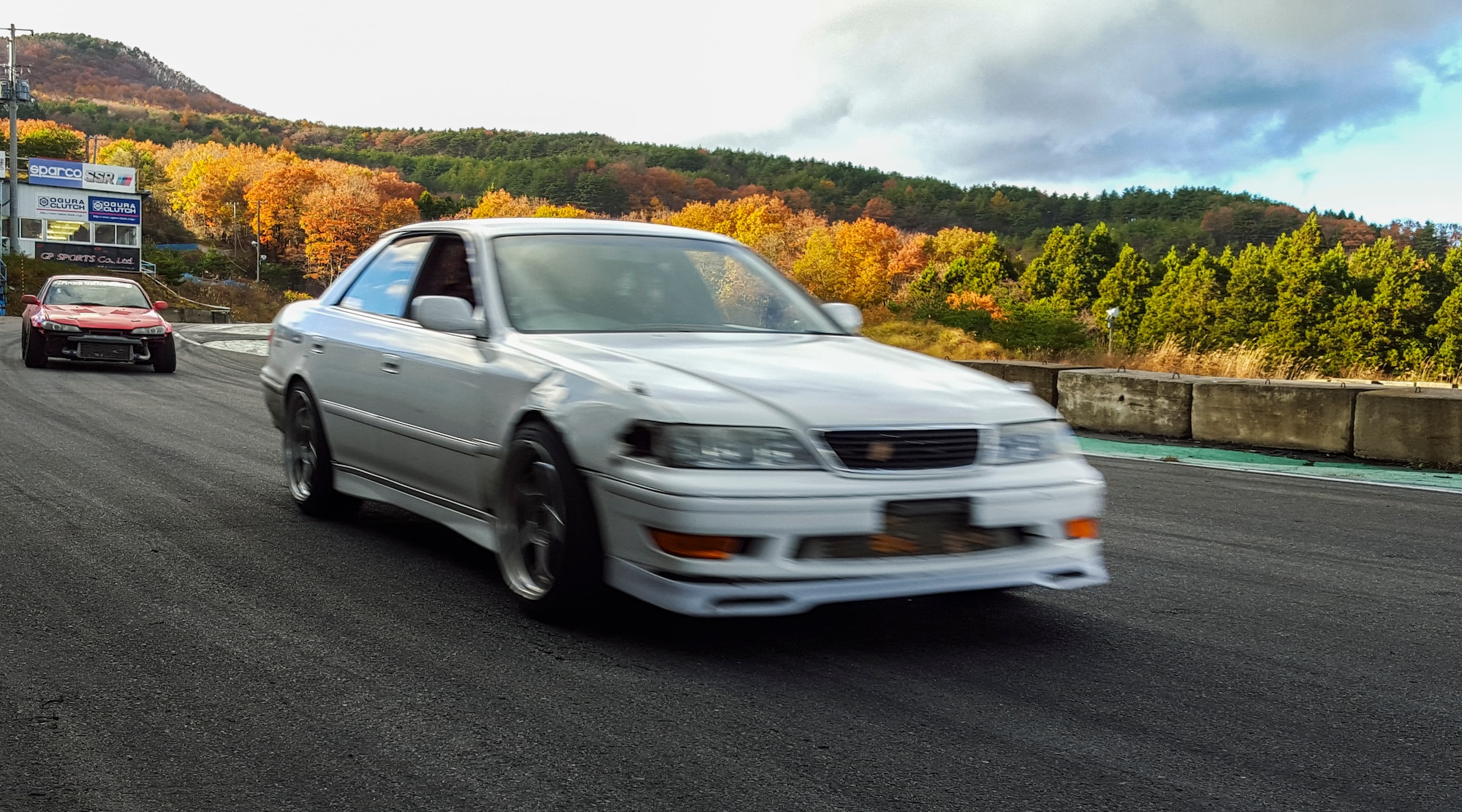 Participants in the Ebisu Circuit fall drift festival compete on Minami course at Ebisu Circuit, Japan, Nov. 15, 2015. Drifting is a popular sport in Japan characterized by driving in a controlled slide around turns. Airmen participating in drift events have the opportunity to meet drift enthusiasts from Japan and around the world. (U.S. Air Force photo by Airman 1st Class Elizabeth Baker/Released)
