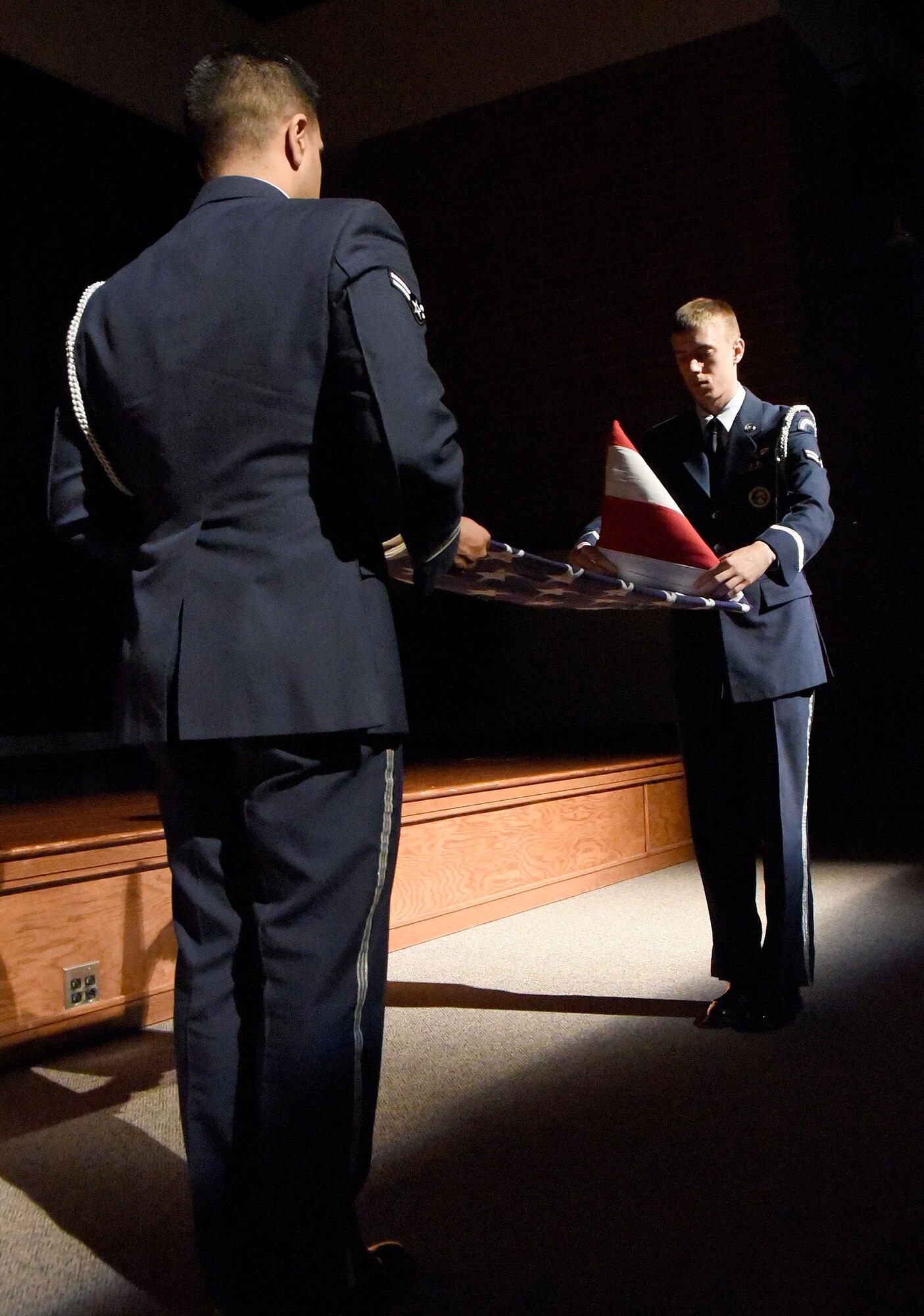 Members of the Joint Base McGuire-Dix-Lakehurst Honor Guard perform a flag-folding display during the retirement ceremony for Chief Master Sgt. Pete Stone Nov. 30, here. Stone retires after serving 30 years on active duty.(U.S. Air Force photo/Danielle Brooks)
