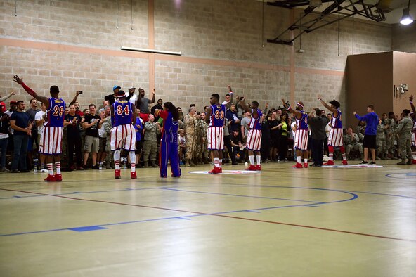 The Harlem Globetrotters thank service members in the audience following a performance at an undisclosed location in Southwest Asia, Dec. 3, 2015. During their visit to the 386th Air Expeditionary Wing, the team put on a show and hosted a meet-and-greet open to all service members deployed in support of Operation INHERENT RESOLVE. (U.S. Air Force photo by Staff Sgt. Jerilyn Quintanilla)