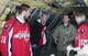 Technical Sgt. Matt Oberlin, 756th Air Refueling Squadron boom operator (right), explains the role and operations of a boom operator to a group of Washington Capitals players on board a 459th Air Refueling Wing KC-135R Stratotanker on Joint Base Andrews, Md., flight line Dec. 1, 2015. . The Capitals visited JBA to learn about the Air Force mission here. They observed special performances by the U.S. Air Force band Max Impact, Honor Guard, 11th Wing Explosive Ordnance Disposal, as well as static displays from the 1st Helicopter Squadron and 459 ARW, 113th Wing, Air National Guard. (U.S. Air Force photo by Staff. Sgt. Kat Justen)
