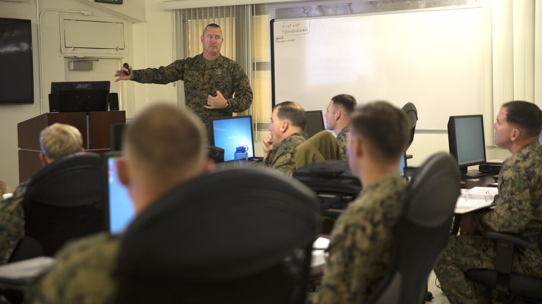 Master Gunnery Sgt. Dan Barker, staff non-commissioned officer in charge, Marine Corps Communication-Electronics School, instructs the first Advance Explosive Ordnance Disposal Ordnance Exploitation Course hosted by the EOD Advanced Training Center at Marine Corps Air Ground Combat Center, Twentynine Palms, Calif., Nov. 30, 2015. Eight select Marine EOD officers and enlisted members gathered from various Marine Corps installations to participate in the three-week course.