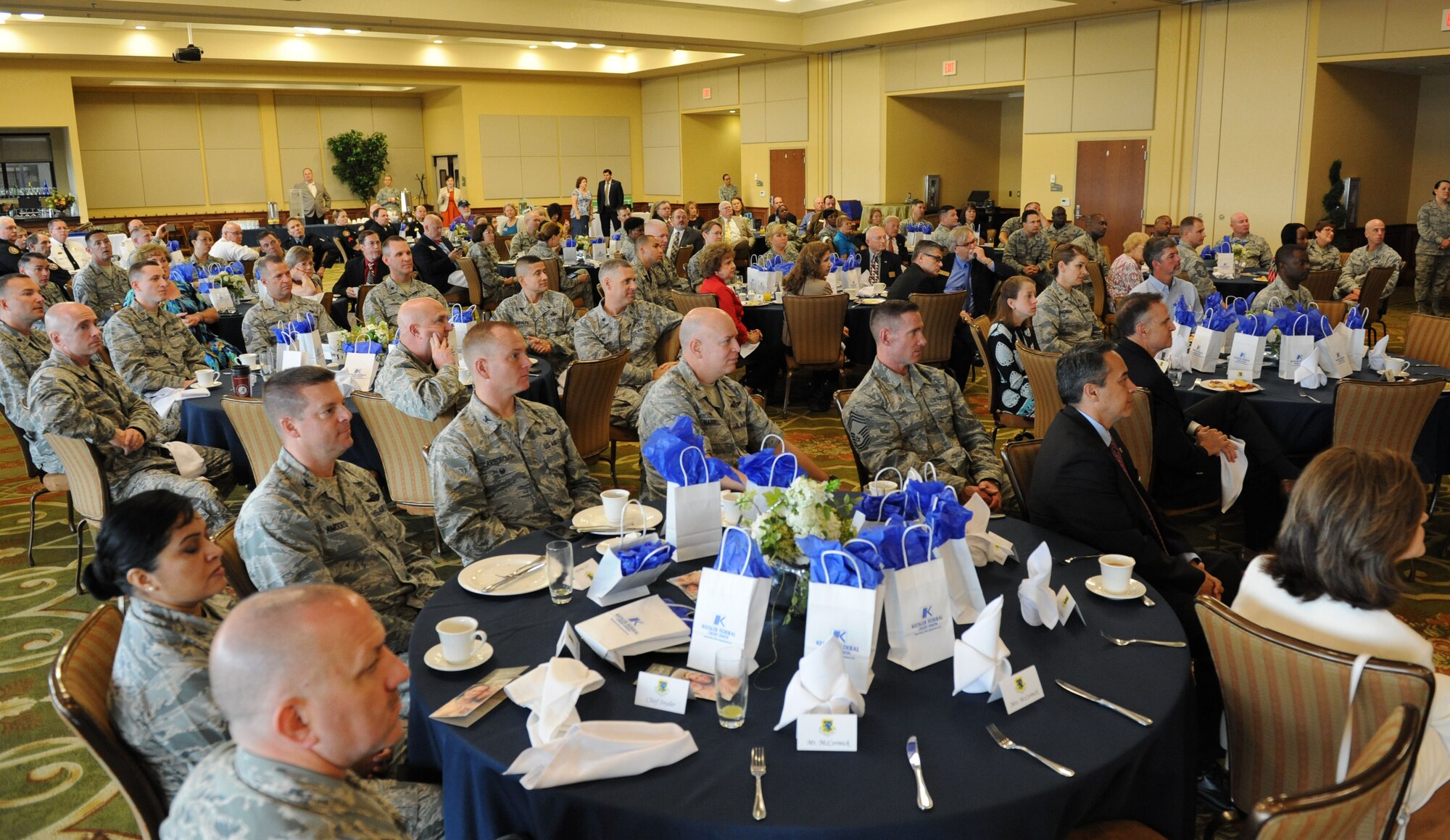 Airmen and local community personnel listen to key speakers during the Biloxi Chamber of Commerce Morning Call at the Bay Breeze Event Center Dec. 1, 2015, Keesler Air Force Base, Miss. Keesler hosted the event. (U.S. Air Force photo by Kemberly Groue)