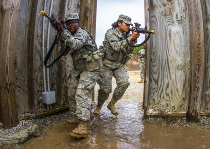 Two Soldiers in basic combat training with B Company, 2nd Battalion, 39th Infantry Regiment rehearse a room clearance while at the Urban Assault Course located on Fort Jackson, S.C., Dec. 3, 2015. (U.S. Army photo by Sgt. 1st Class Brian Hamilton)