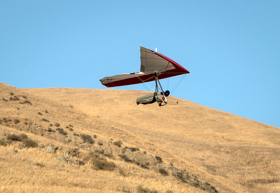 Staff Sgt. Tevni Carrillo, a 9th Air Refueling Squadron KC-10 Extender flight engineer, glides just after takeoff from a 150-foot gliding point at Ed R. Levin County Park, Calif., Sept. 9, 2015. Carrillo's experience as a flight engineer and crew chief has opened his mind up to the idea of piloting a hang glider of his own. This photo is from the latest Airman Magazine feature story "Hang in there." To see more: http://airman.dodlive.mil/2015/11/hang-in-there/#sthash.LhbcQgss.dpuf. (U.S. Air Force photo/Staff Sgt. Vernon Young Jr.)