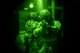 Airmen from the 320th Special Tactics Squadron clear a hallway Nov. 19, 2015, in a shoot house at Camp Hansen, Japan. The Airmen cleared the house as part of training led by the Direct Action Resource Center during a two-week course where a group of pararescuemen, combat controllers and force reconnaissance Marines develop skills they can use when they deploy with other joint special operations teams. (U.S. Air Force photo/Senior Airman John Linzmeier)