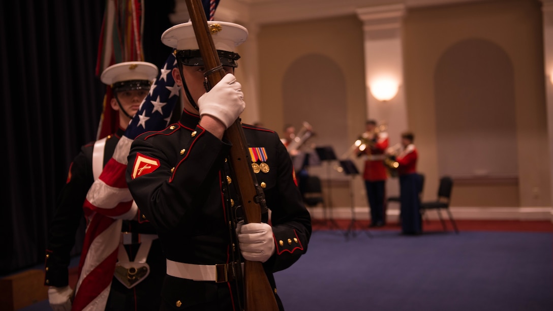 A Marine Corps color guard posts the colors during a ceremony for the 240th Anniversary of the Navy Chaplain Corps hosted at Crawford Hall in Marine Barracks Washington, Dec. 3, 2015. Every year, chaplains from around the world gather to celebrate the anniversary of the Navy Chaplain Corps.