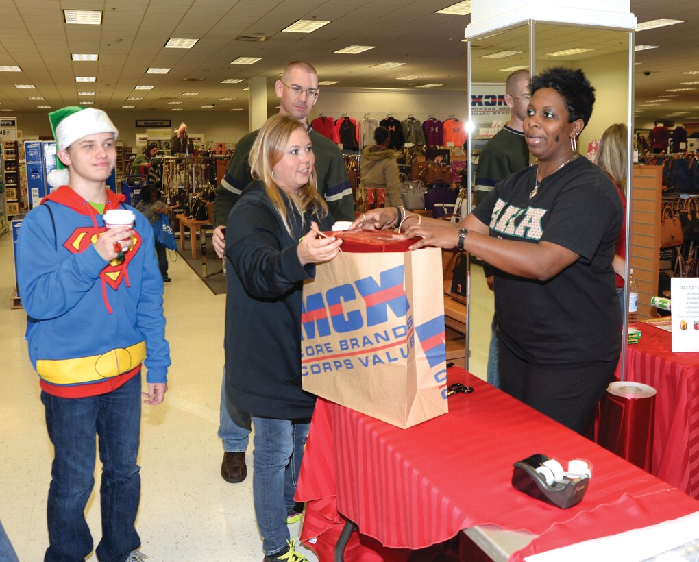 The Tolleson family takes advantage of shopping opportunities, which the Marine Corps Exchange aboard Marine Corps Logistics Albany offers to active-duty service members, retirees and their family members. Although security may not be a major concern for eligible patrons while shopping on the installation, local law enforcement and base officials urged residents to exercise caution when shopping off base during this holiday season.
