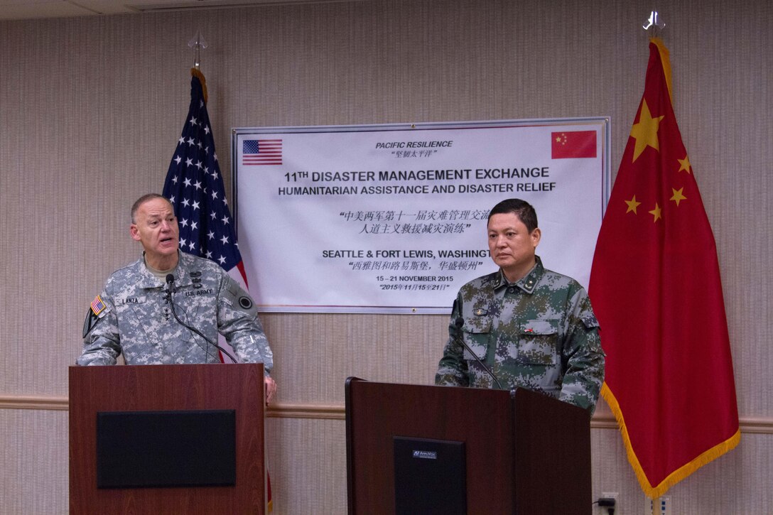 U.S. Army Maj. Gen. Stephen Lanza, commander of I Corps and Joint Base Lewis-McChord, left, and Maj. Gen Zhang Jian, commander, Hainan Provincial Military District, People’s Republic of China People’s Liberation army, hold a press conference during a disaster management exchange at Joint Base Lewis-McChord, Wash., Nov. 20, 2015. U. S. Army photo by Sgt. Jasmine Higgins