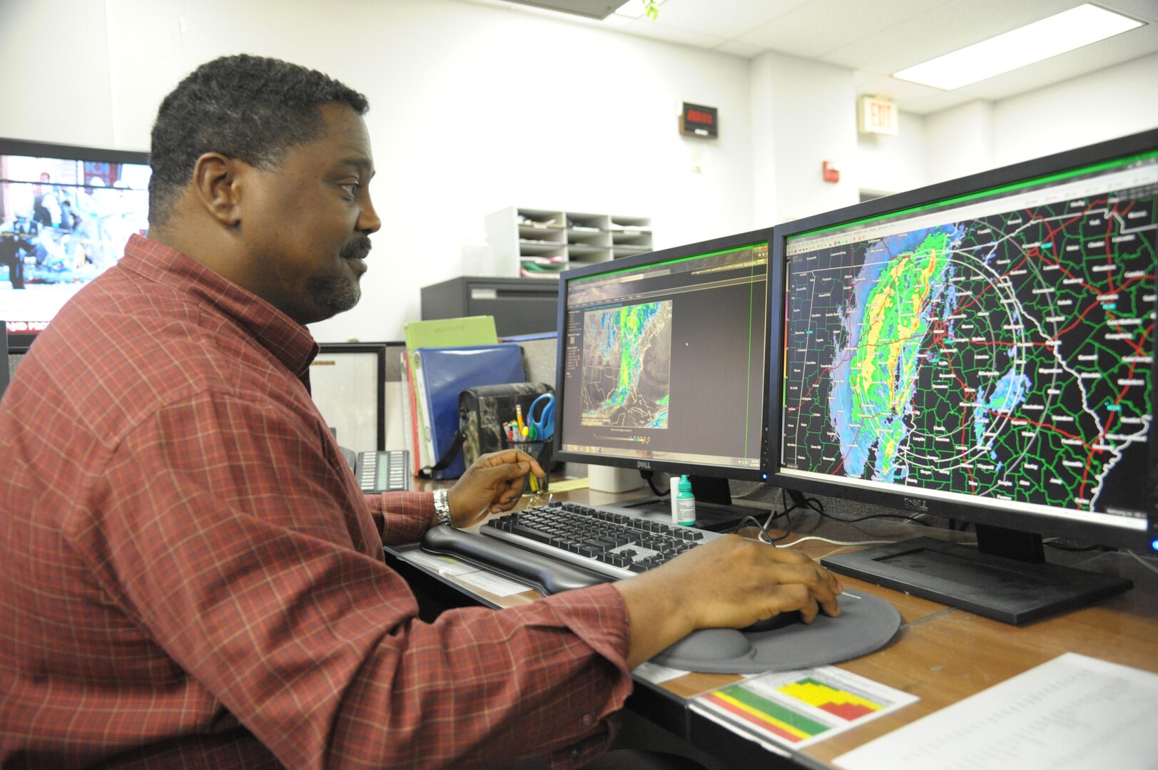 Sam Smith, 12th Operations Support Squadron, weather technician, tracks the weather forecast  for inbound and outbound flights, at Joint Base San Antonio-Randolph, Nov. 18, 2015. The 12th OSS is responsible for pilot instructor training and introduction to fighter fundamentals academic and simulator training, scheduling, air traffic control, airfield management, flight records, registrar, weather, airspace management, international training and aircrew flight equipment for all 12th Operational Group training.  (U.S. Air Force photo by Joel Martinez/Released)