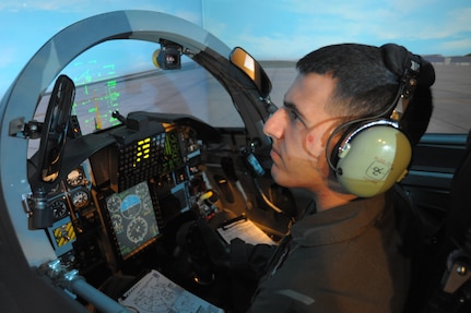 Second Lt. Nicklas Castle, 435th Fighter Trianing Squadron student, trains on a T-38 simulator Nov. 19, 2015, at Joint Base San Antonio-Randolph, Texas. The 12th OSS is responsible for pilot instructor training and introduction to fighter fundamentals academic and simulator training, scheduling, air traffic control, airfield management, flight records, registrar, weather, airspace management, international training and aircrew flight equipment for all 12th Operations Group training.  (U.S. Air Force photo by Joel Martinez/Released)
