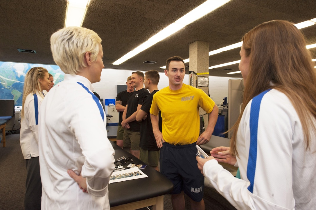 U.S. Women’s National Soccer Team athletes thank wounded warriors for their service during a visit to Makalapa Clinic on Joint Base Pearl Harbor-Hickam, Hawaii, Dec. 3, 2015. U.S. Navy photo by Petty Officer 2nd Class Jerome D. Johnson