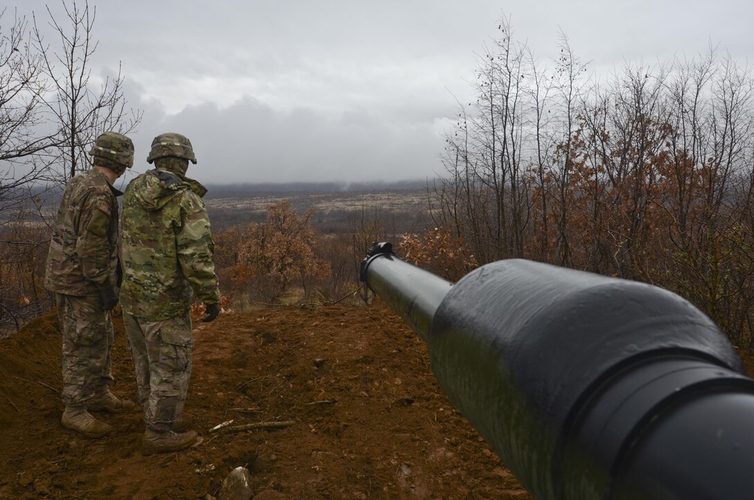 U.S. Army Sgt. 1st Class Edward Barnett, right, and Spc. James Brown inspect the position of their M1A2 Abrams tank during Exercise Peace Sentinel at Novo Selo Training Center, Bulgaria, Nov. 23, 2015. Barnett is a tank commander and Brown is a gunner, and both are assigned to the 3rd Infantry Division’s 5th Squadron, 7th Cavalry Regiment. U.S. Army photo by Staff Sgt. Steven M. Colvin