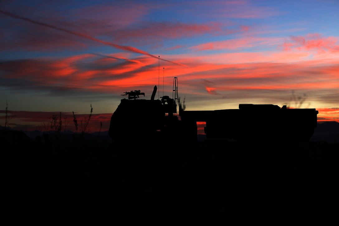 Marines wait to fire a High-Mobility Artillery Rocket System in support of Steel Knight aboard Marine Corps Base Camp Pendleton, Calif., Dec. 4, 2015. Steel Knight is a 1st Marine Division led exercise which enables the Marines and sailors to operate in a realistic combined-arms environment to develop skill sets necessary to operate as a fully capable Marine Air Ground Task Force. The Marines are assigned to Battery Q, 5th Battalion, 11th Marine Regiment, 1st Mar. Div.