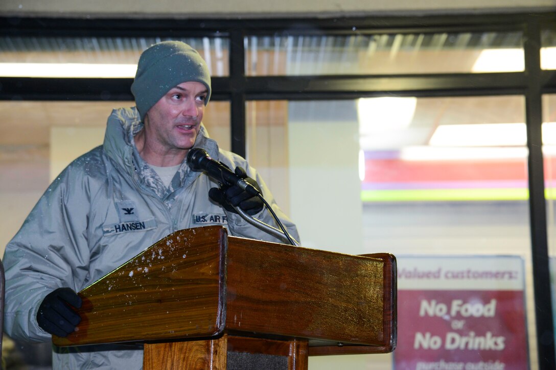 Col. Andrew Hansen, 51st Fighter Wing commander, speaks during the annual Holiday Tree Lighting ceremony at Osan Air Base, Republic of Korea, Dec. 3, 2015. Hansen thanked Team Osan for attending and the base chapel gospel service children's choir for their carols. (U.S. Air Force photo/Airman 1st Class Dillian Bamman)