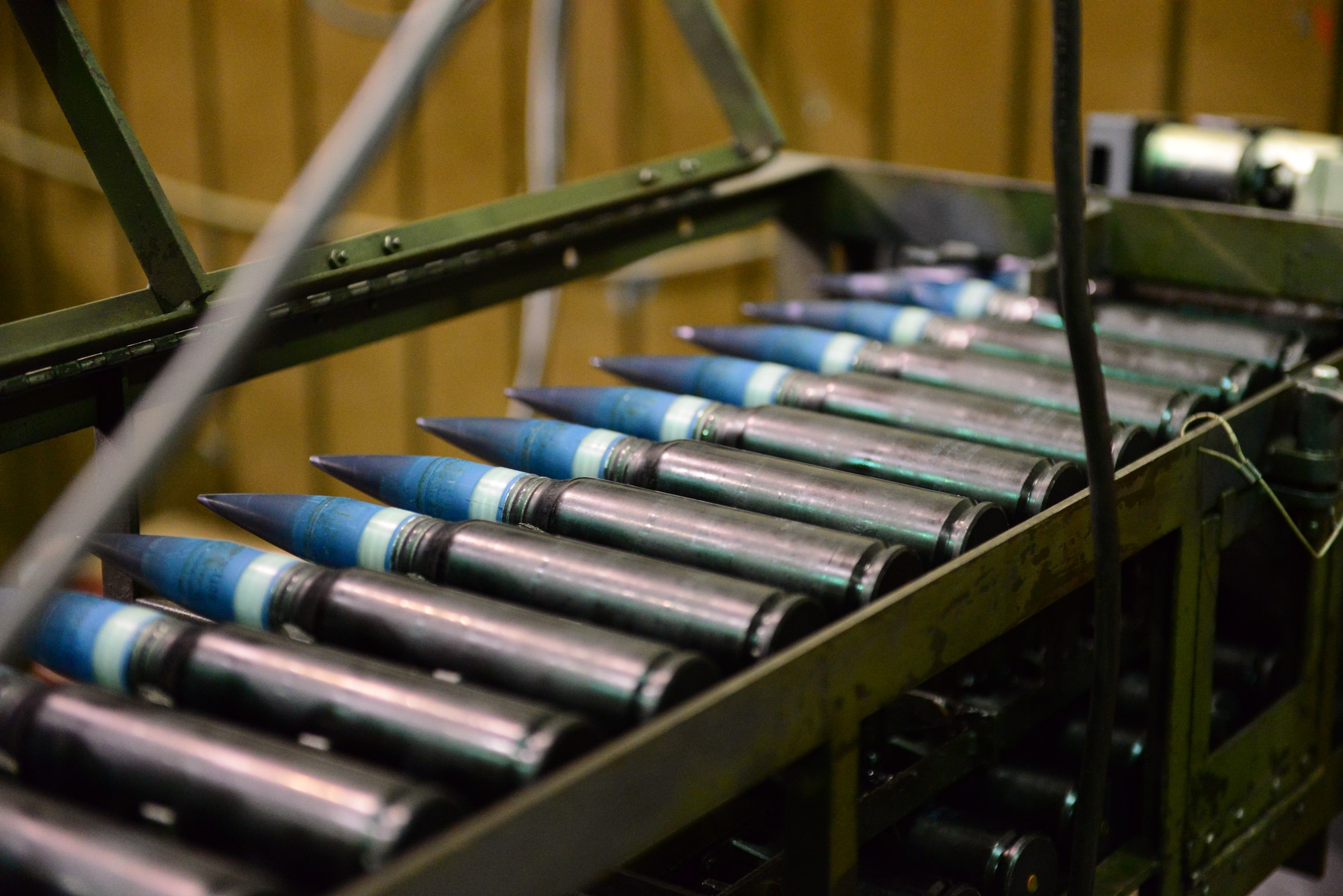 A row of 30mm rounds for the A-10 Thunderbolt II’s GAU-8 Avenger rotary cannon are inspected for casing discrepancies at Osan Air Base, Republic of Korea, Nov. 17, 2015. Airmen from the 51st Munitions Squadron preload shop ensure the proper load-out of 1,150 rounds in each magazine.
(U.S. Air Force photo/Staff Sgt. Amber Grimm)