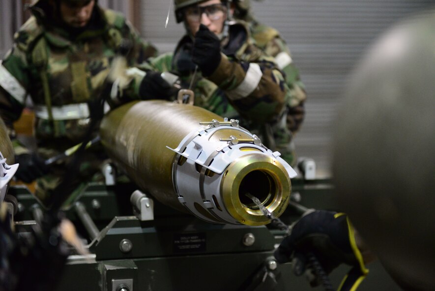 Airmen from the 51st Munitions Squadron assemble various bomb components during exercise Vigilant Ace 16 at Osan Air Base, Republic of Korea, Nov. 6, 2015. The sensitivity of the devices to radio signals and electricity is something that must be kept in mind during each construction and requires the establishment of maximum safe distance evacuation points.  
(U.S. Air Force photo/Staff Sgt. Amber Grimm)