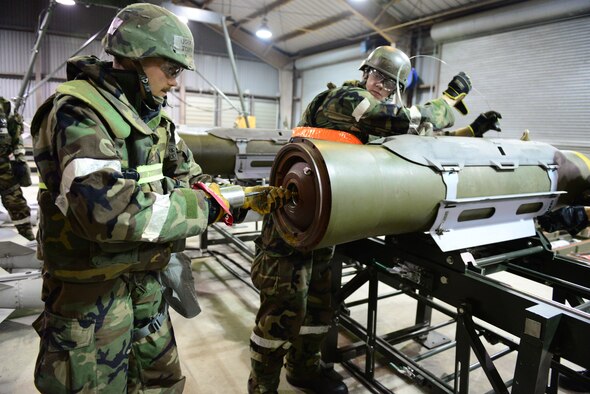 Airmen from the 51st Munitions Squadron assemble various bomb components during exercise Vigilant Ace 16 at Osan Air Base, Republic of Korea, Nov. 6, 2015. The sensitivity of the devices to radio signals and electricity is something that must be kept in mind during each construction and requires the establishment of maximum safe distance evacuation points.  
(U.S. Air Force photo/Staff Sgt. Amber Grimm)