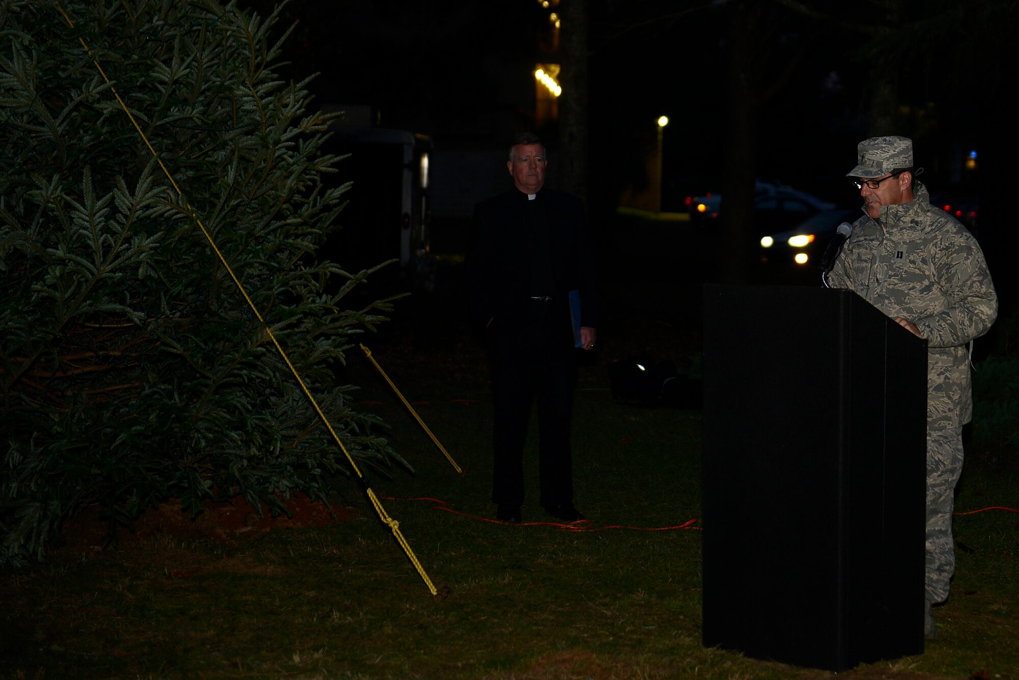 U.S. Air Force Chaplain (Capt.) James Finley, 20th Fighter Wing chaplain, kicks off a Christmas Tree Lighting/Religious Display Interfaith Ceremony at the Friendship Chapel, Dec. 3, 2015, at Shaw Air Force Base, S.C. During the ceremony, stories of holidays originating from the Eastern Christian, Western Christian, Wiccan/Pagan, and Jewish religions were read to guests in attendance. (U.S. Air Force photo by Airman 1st Class Christopher Maldonado)