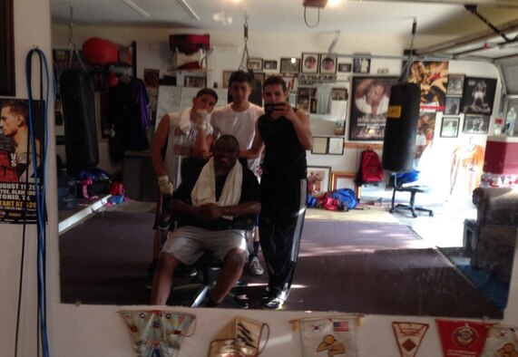 U.S. Air Force Reserve Senior Airman Cesar Zayas (standing, right) takes a photo of himself and members of his Junior Olympic boxing training team at Municipal Boxing Gym in Salinas, Puerto Rico. Zayas discovered a love for boxing at a young age thanks to his father and says it changed his life forever. (Courtesy photo)  
