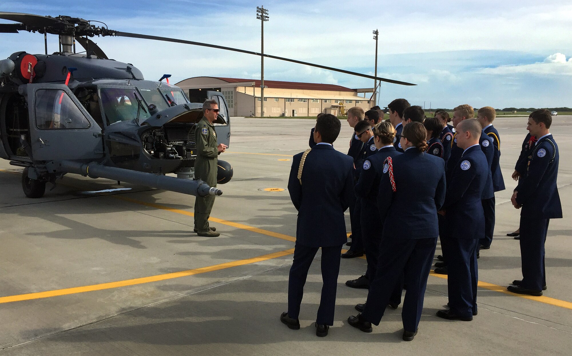 Lt. Col. Robert Haston, HH-60G Pave Hawk helicopter pilot with the 920th Rescue Wing here, explains the flight systems of the aircraft to a group of Air Force Junior ROTC cadets from nearby Satellite Beach High School. (U.S. Air Force photo/Master Sgt. Paul Flipse)