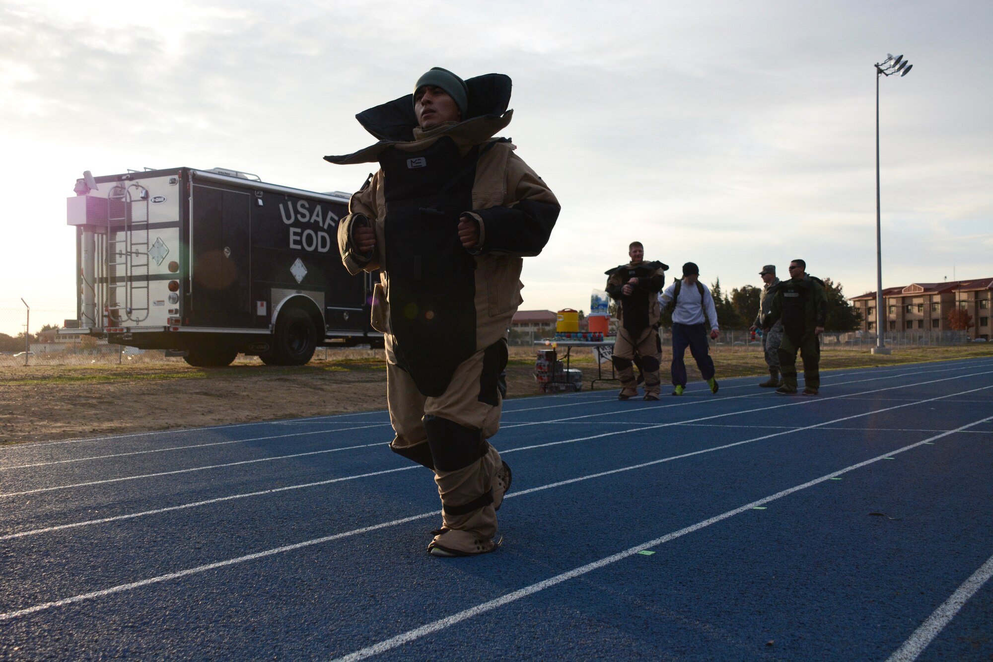 A participant runs a 5K in a 75-pound bomb suit Nov. 30 at Travis Air Force Base, Calif. The bomb suit 5K was part of  explosive ordnance disposal safety day. (U.S. Air Force photo/Airman 1st Class Amber Carter)