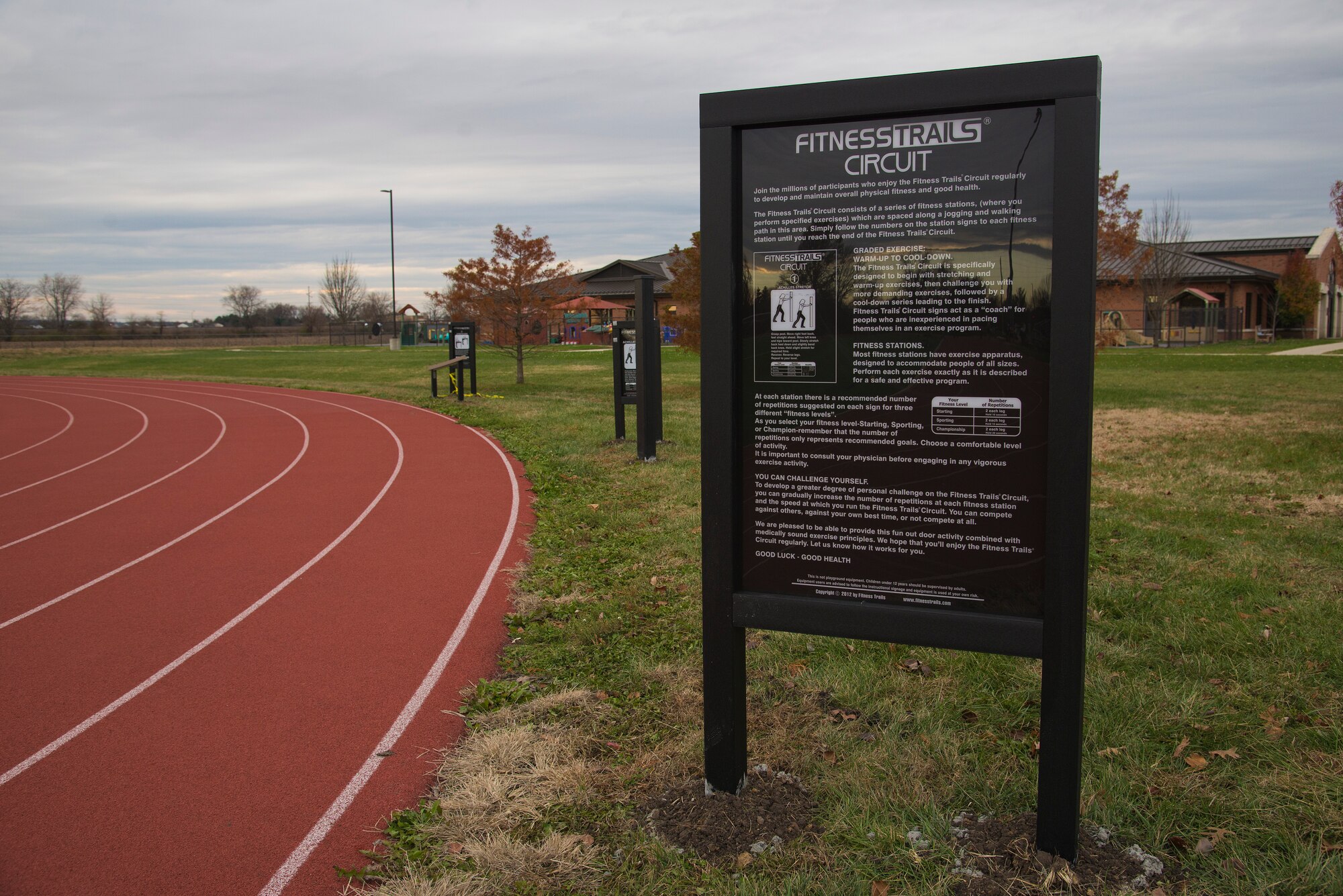 A new Fitness Circuit has been installed around the James Gym track, November 24, 2015 at Scott Air Force Base, Illinois. The fitness trails circuit is designed to begin with stretching and warm-up exercises then to challenge you with more demanding exercises, followed by a cool down series leading to the finish.  (U.S. Air Force photo by Airman Gwendalyn Smith) 