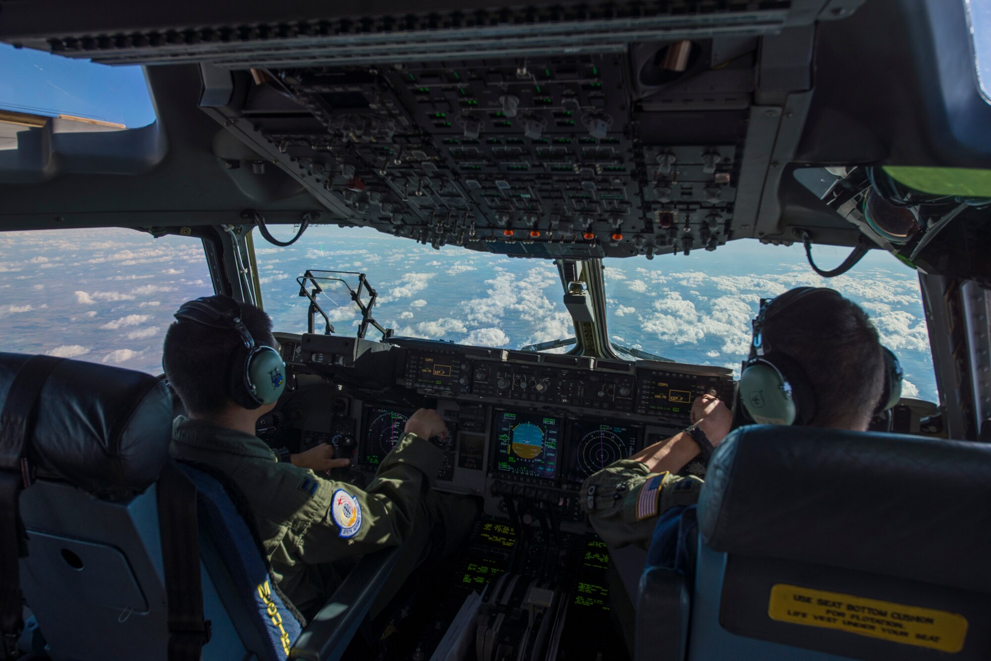 Pilots from the 6th Airlift Squadron, Joint Base McGuire-Dix-Lakehurst, New Jersey, fly to Pope Field, North Carolina, for a collaborative Air Mobility Command training initiative Nov. 16–20. McGuire’s Capt. Stephen Ching, C-17 pilot, explained that the size and versatility of the aircraft allows plenty of room for people and equipment which makes it an exceptional aircraft for aeromedical training. (U.S. Air Force photo by Airman 1st Class Melissa Estevez)